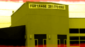 A building with a "For Lease" sign displaying the phone number 281-772-6902.