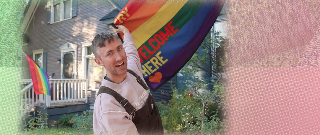 A man holding the pride flag