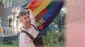 A man holding the pride flag
