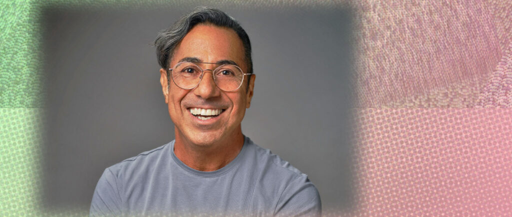 A man wearing a gray T-shirt